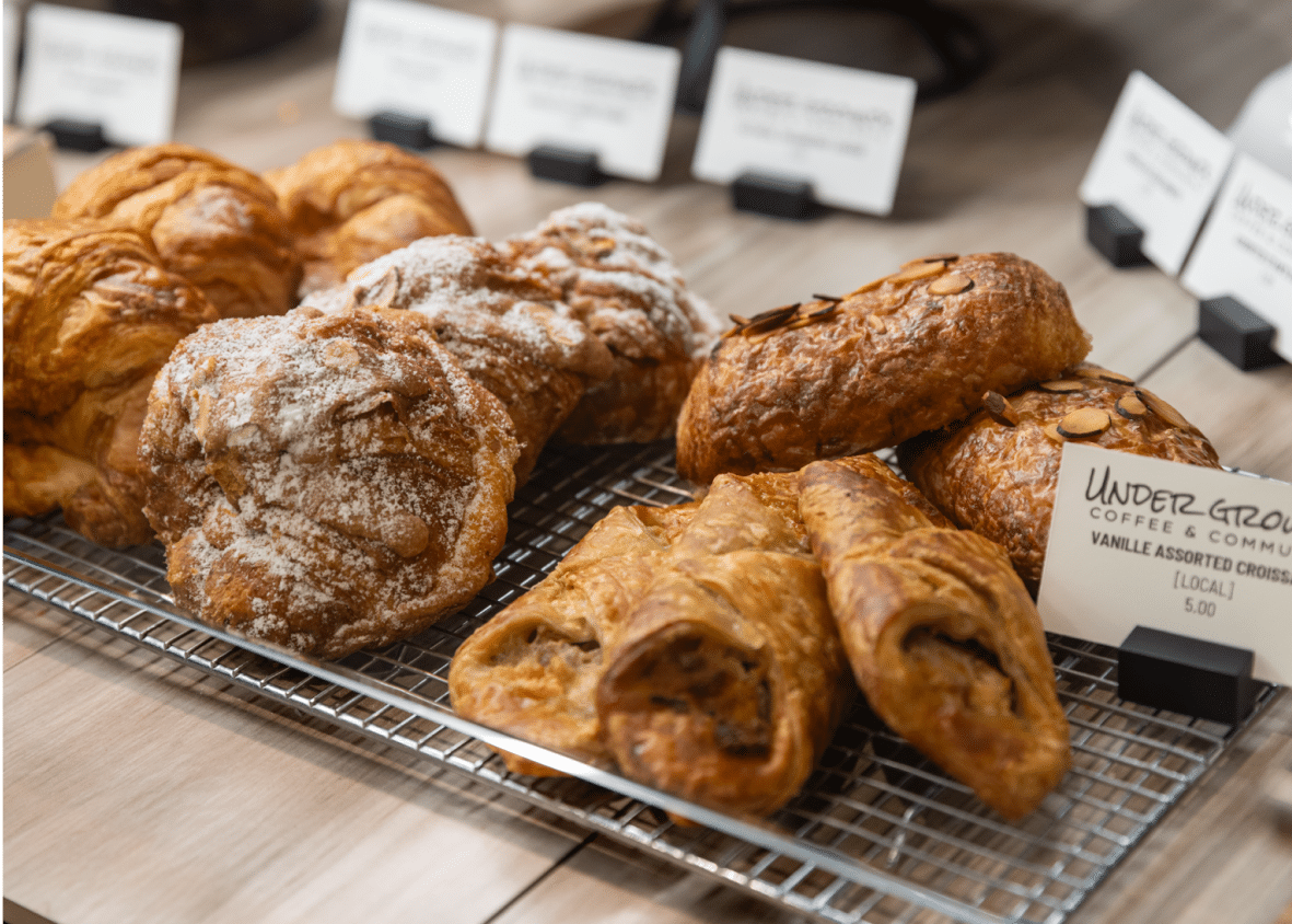 Pastries on a metal tray with label tags