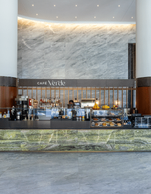 Cafe Verde in a hotel with a barista behind the counter